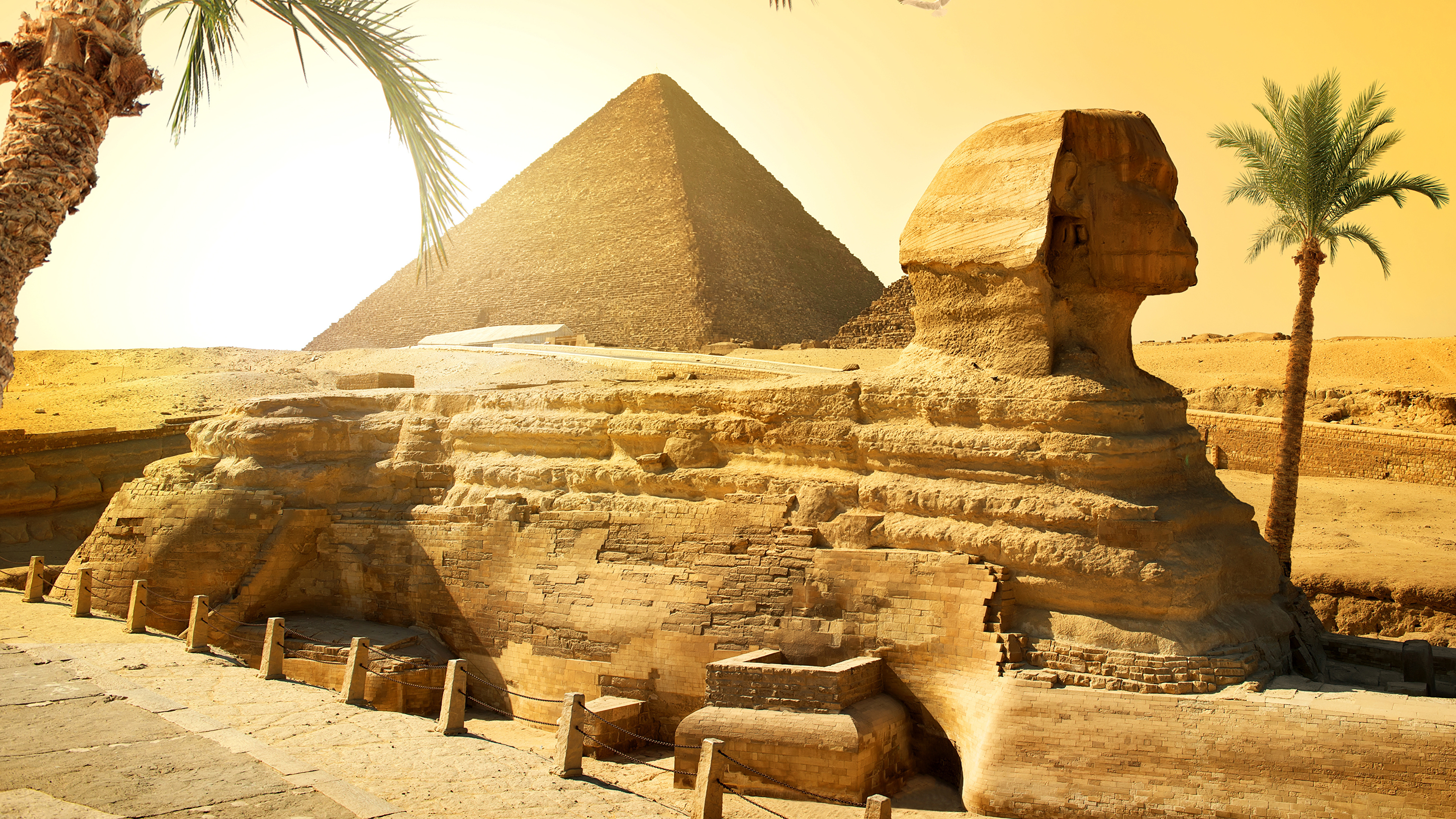 The Egyptian pyramids, which are among the wonders of the world, are  remarkable with their view on a sunny and cloudy day. 2K wallpaper download