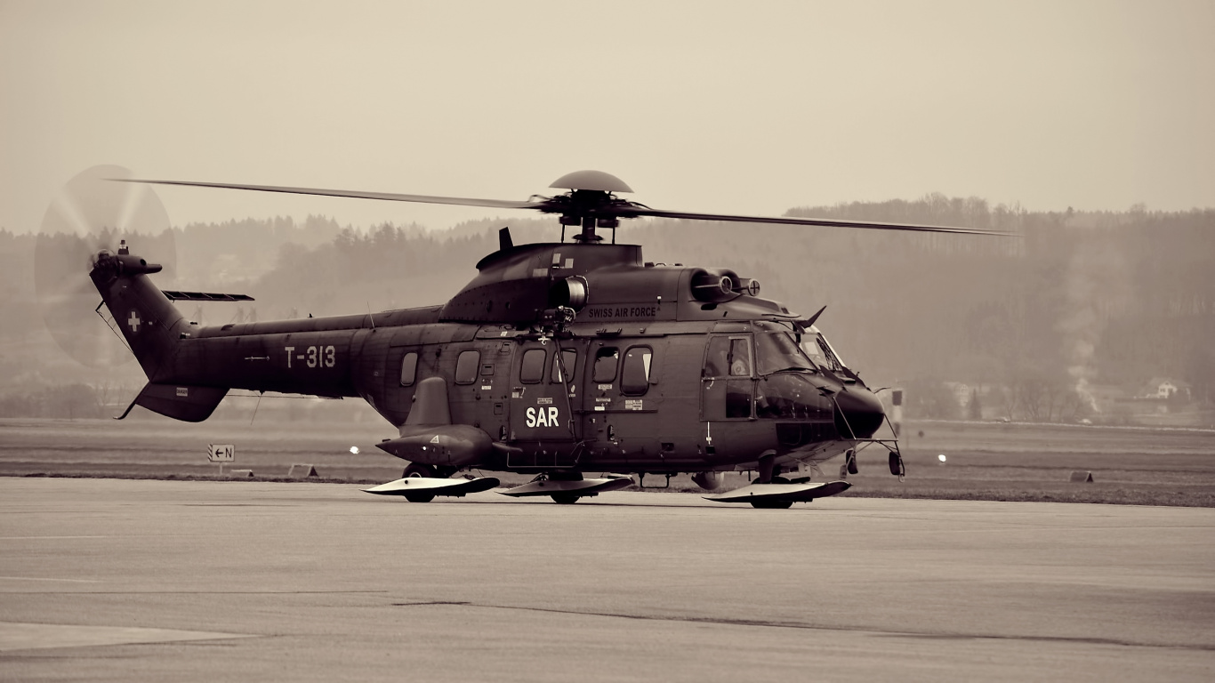 Black and White Helicopter on Gray Field During Daytime. Wallpaper in 1366x768 Resolution