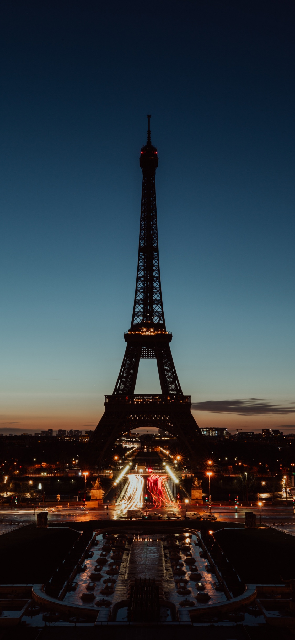 Eiffel Tower in Paris During Night Time. Wallpaper in 1125x2436 Resolution
