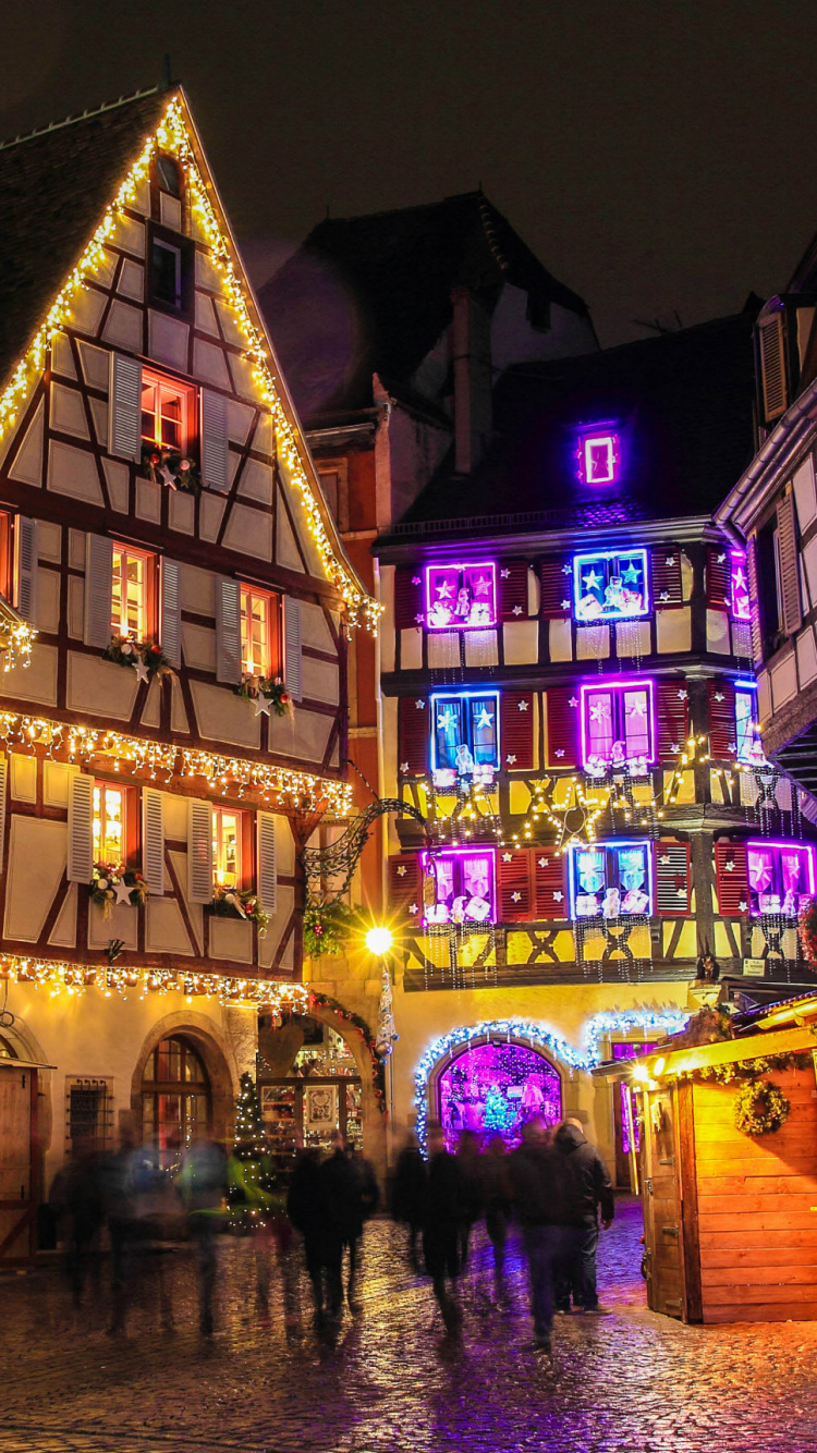 Edificio de Hormigón Marrón Durante la Noche. Wallpaper in 750x1334 Resolution