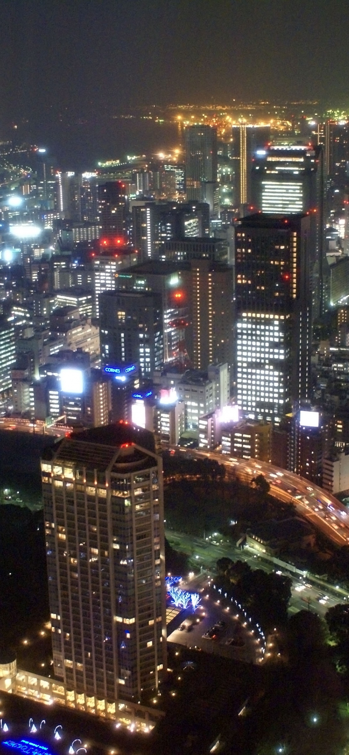 Aerial View of City During Night Time. Wallpaper in 1125x2436 Resolution