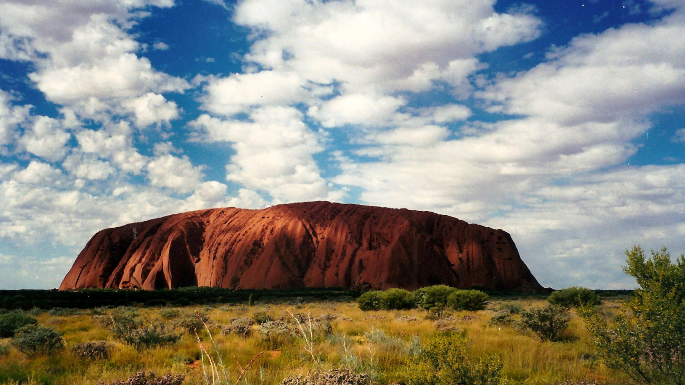 Brown Mountain Under Blue Sky During Daytime. Wallpaper in 1366x768 Resolution