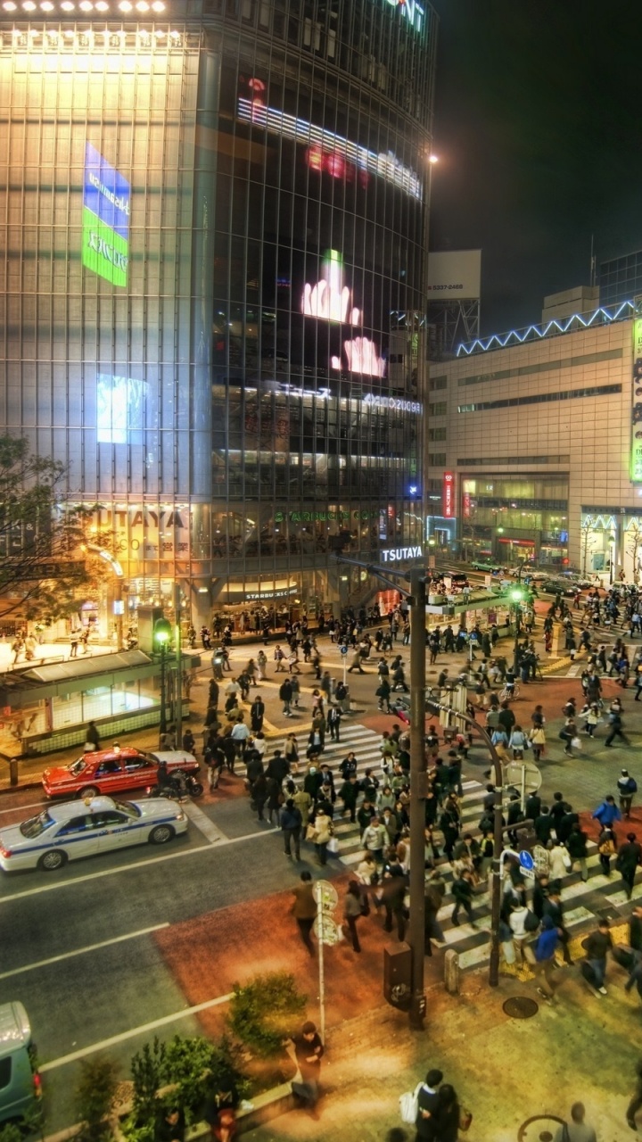 People Walking on Street During Night Time. Wallpaper in 720x1280 Resolution