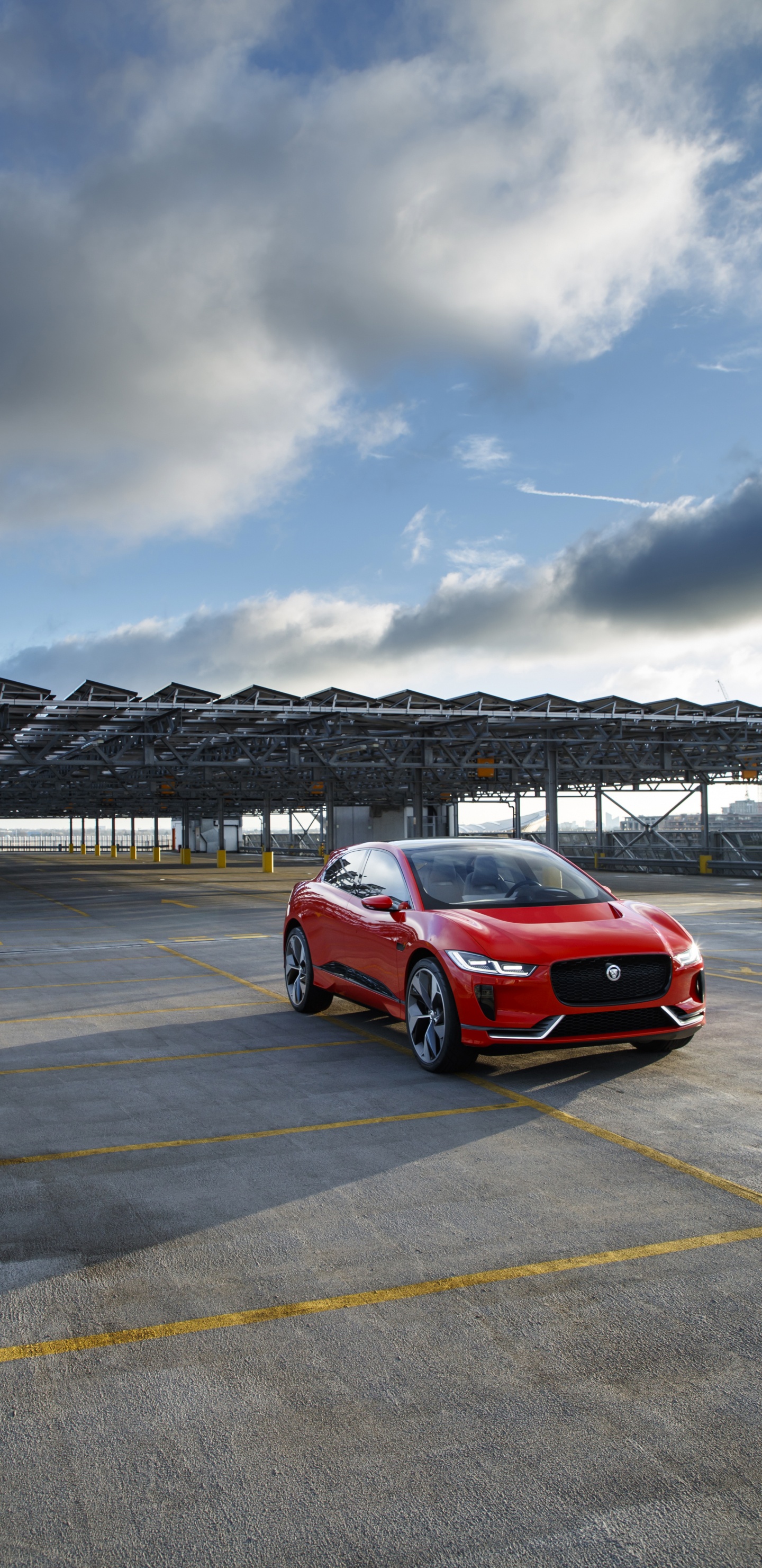 Red Car on Gray Asphalt Road Under Gray Cloudy Sky During Daytime. Wallpaper in 1440x2960 Resolution