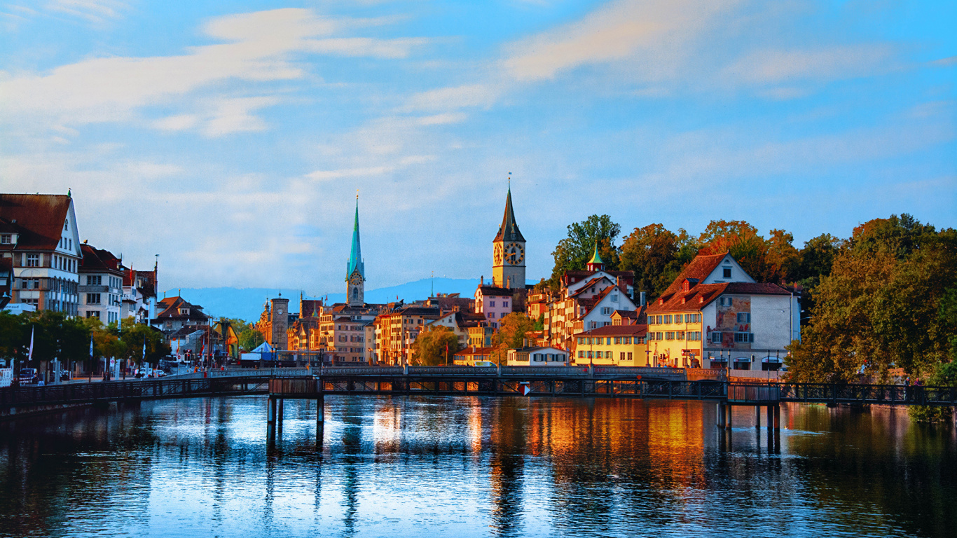 Brown and White Concrete Building Near Body of Water During Daytime. Wallpaper in 1366x768 Resolution