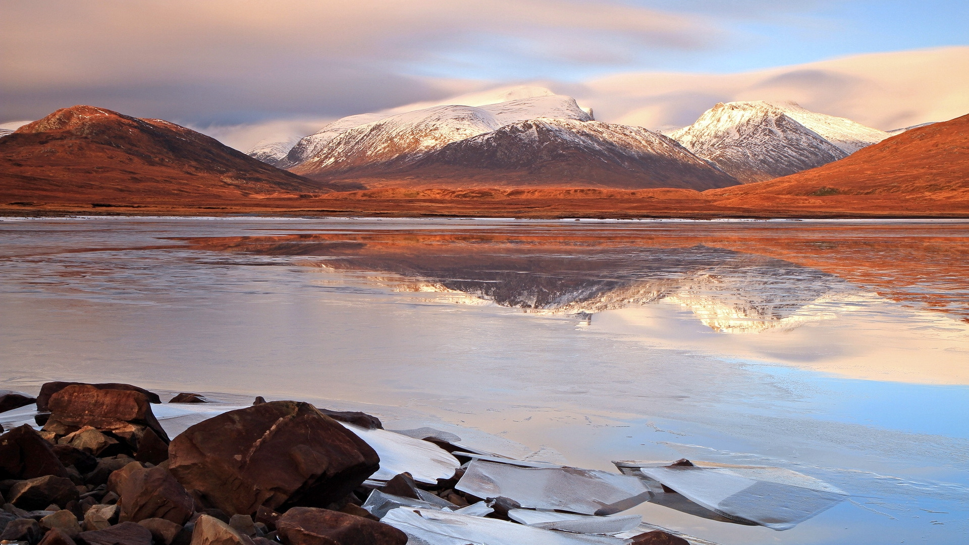 Brown and White Mountains Near Body of Water During Daytime. Wallpaper in 1920x1080 Resolution
