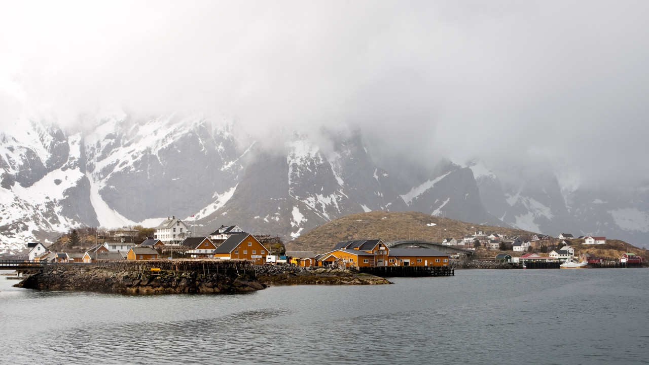 Brown Wooden Houses Near Snow Covered Mountain During Daytime. Wallpaper in 1280x720 Resolution