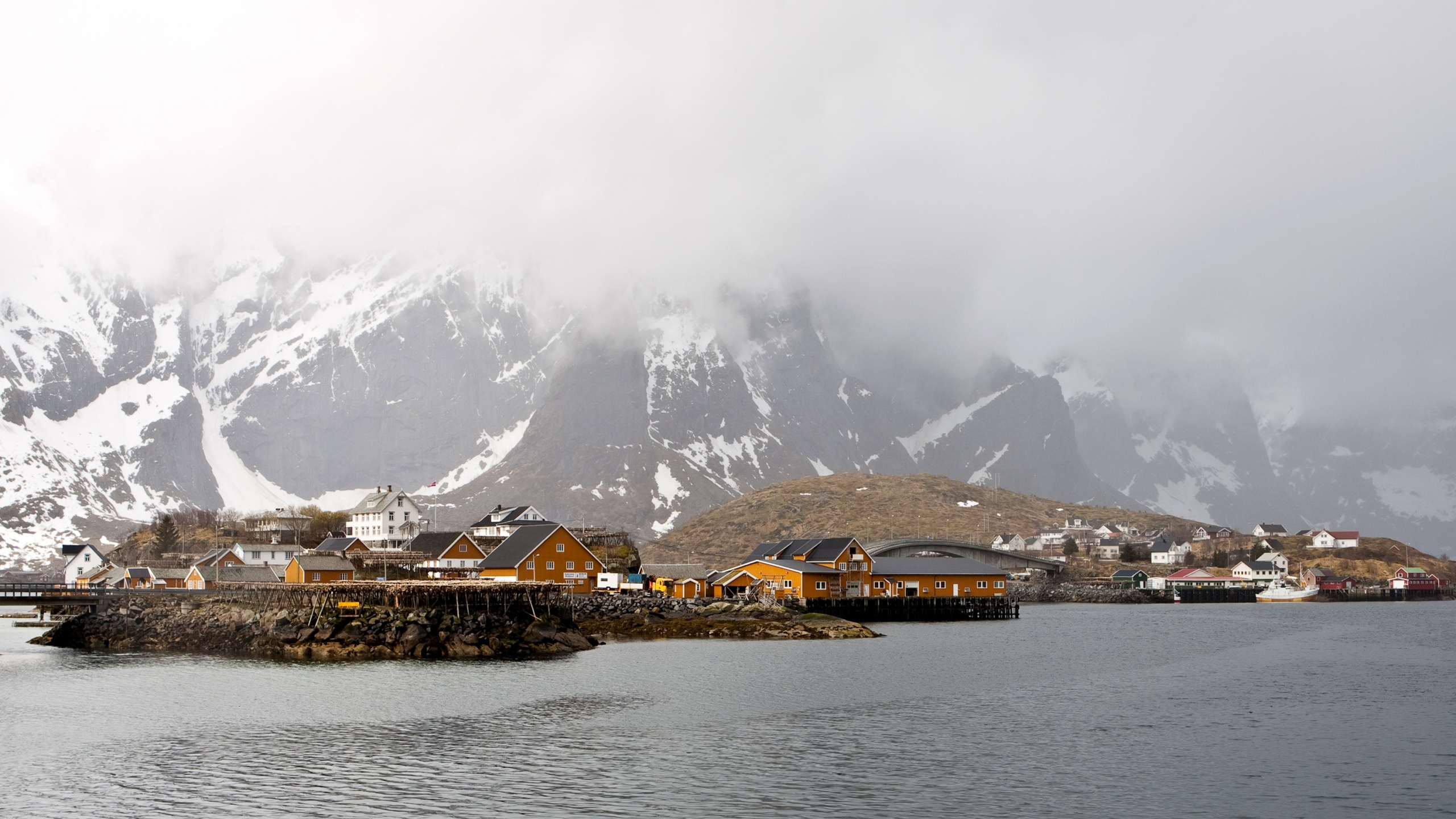 Brown Wooden Houses Near Snow Covered Mountain During Daytime. Wallpaper in 2560x1440 Resolution