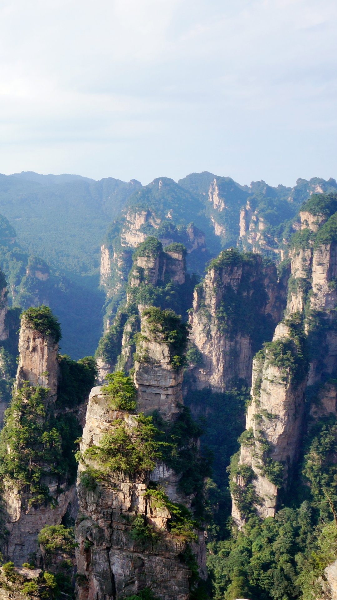 Green and Brown Mountain Under Blue Sky During Daytime. Wallpaper in 1080x1920 Resolution