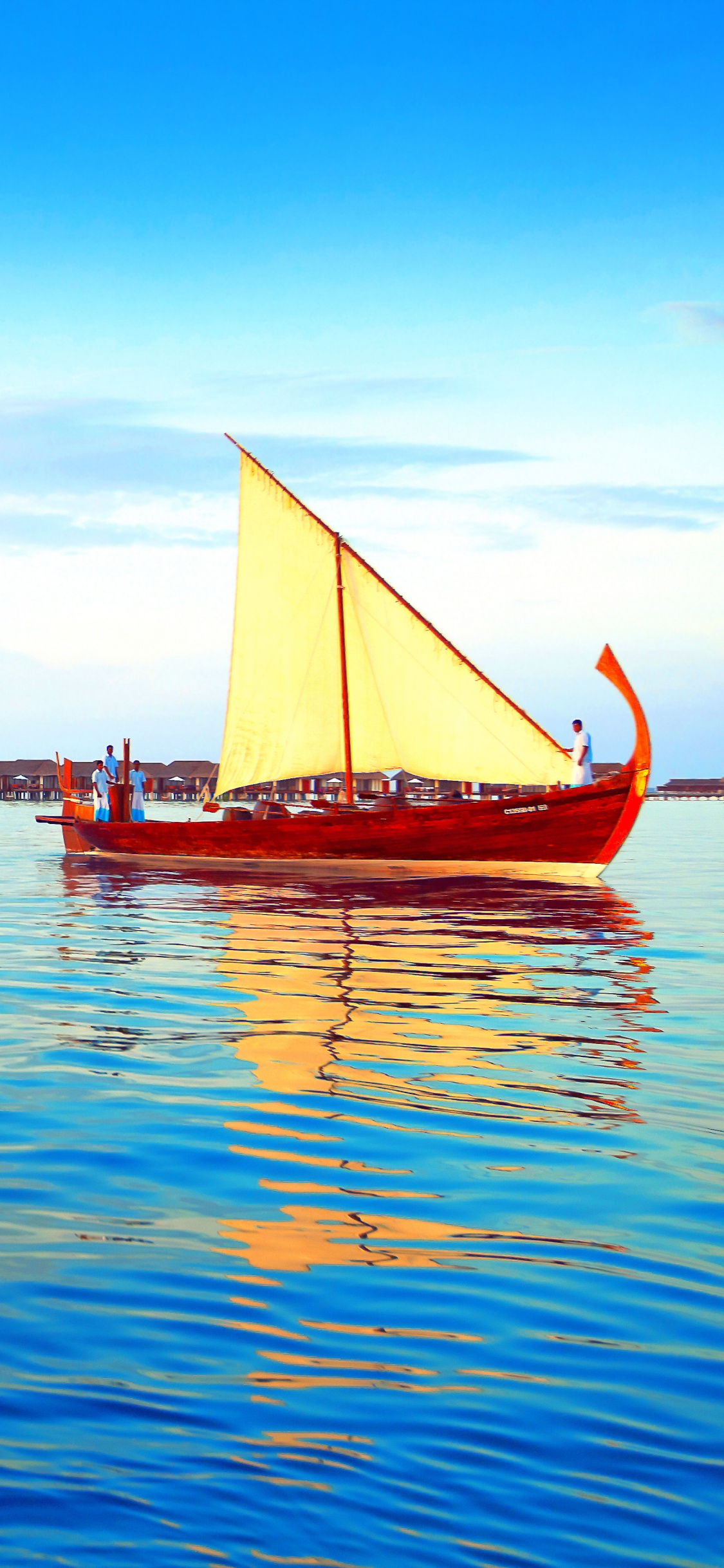 Red Sail Boat on Sea During Daytime. Wallpaper in 1125x2436 Resolution