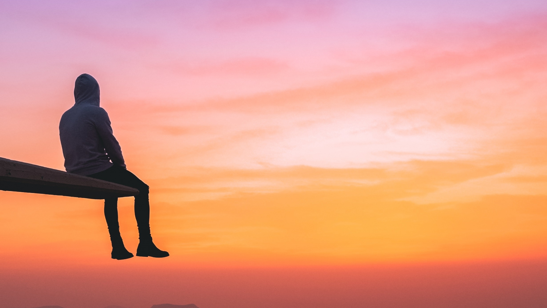 Silhouette of Man Sitting on Rock During Sunset. Wallpaper in 1920x1080 Resolution