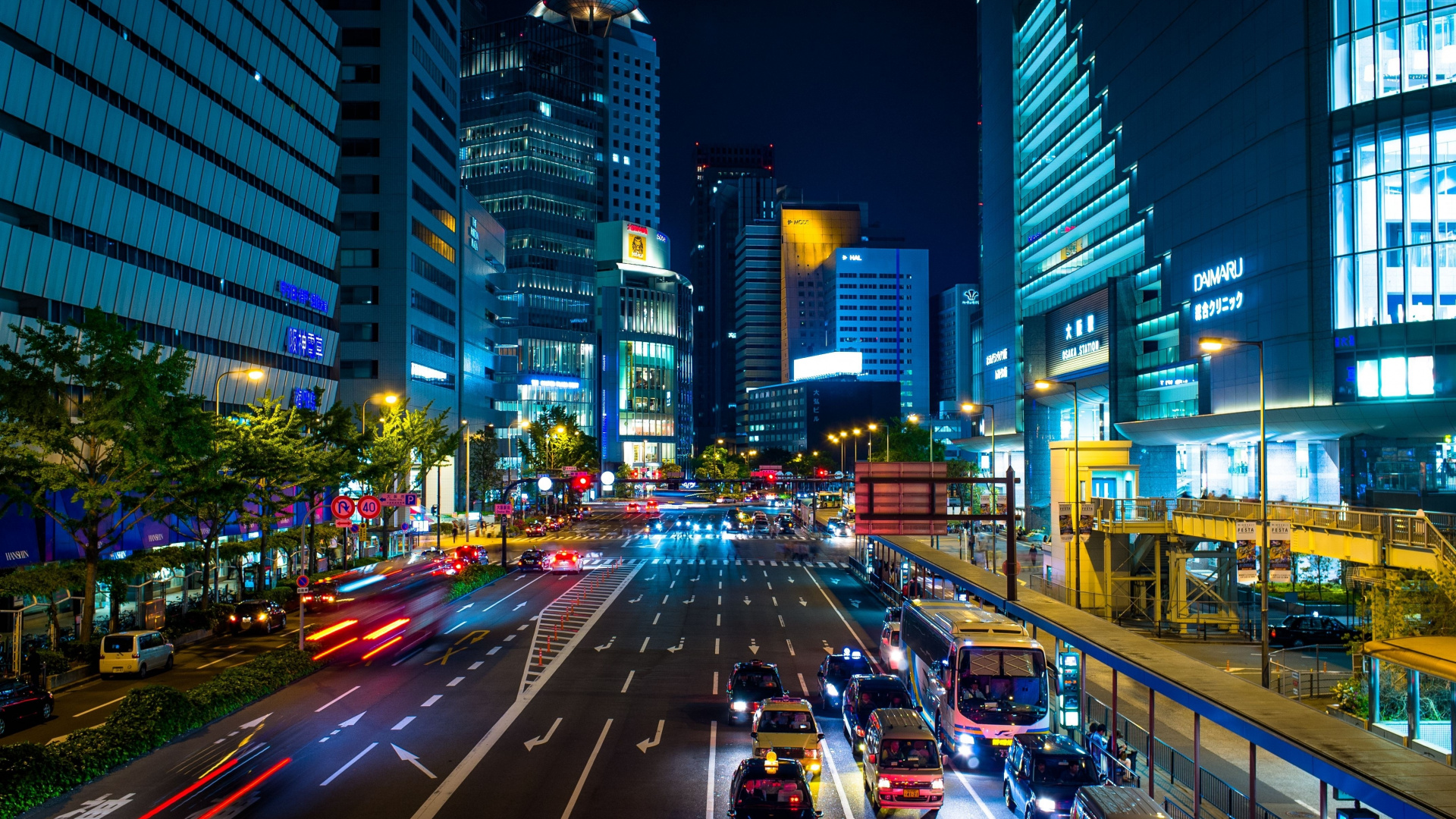Cars on Road Between High Rise Buildings During Night Time. Wallpaper in 1920x1080 Resolution