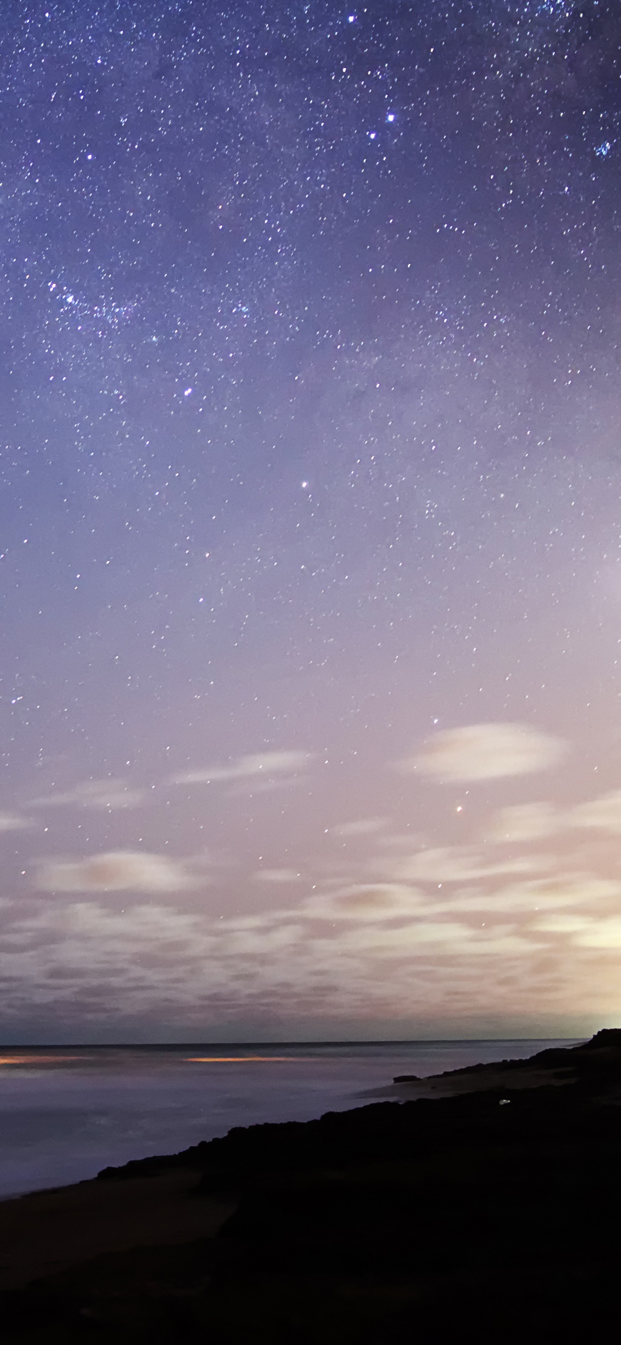 Body of Water Under Starry Night. Wallpaper in 1242x2688 Resolution