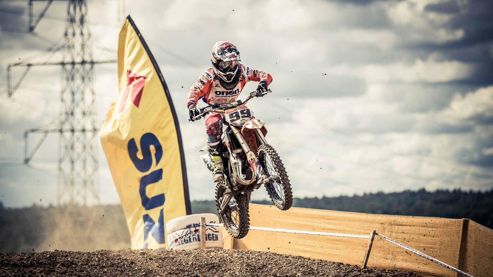 Man in White and Black Racing Suit Riding Yellow and White Dirt Bike. Wallpaper in 1920x1080 Resolution