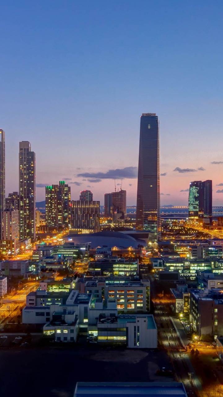 City With High Rise Buildings During Night Time. Wallpaper in 720x1280 Resolution