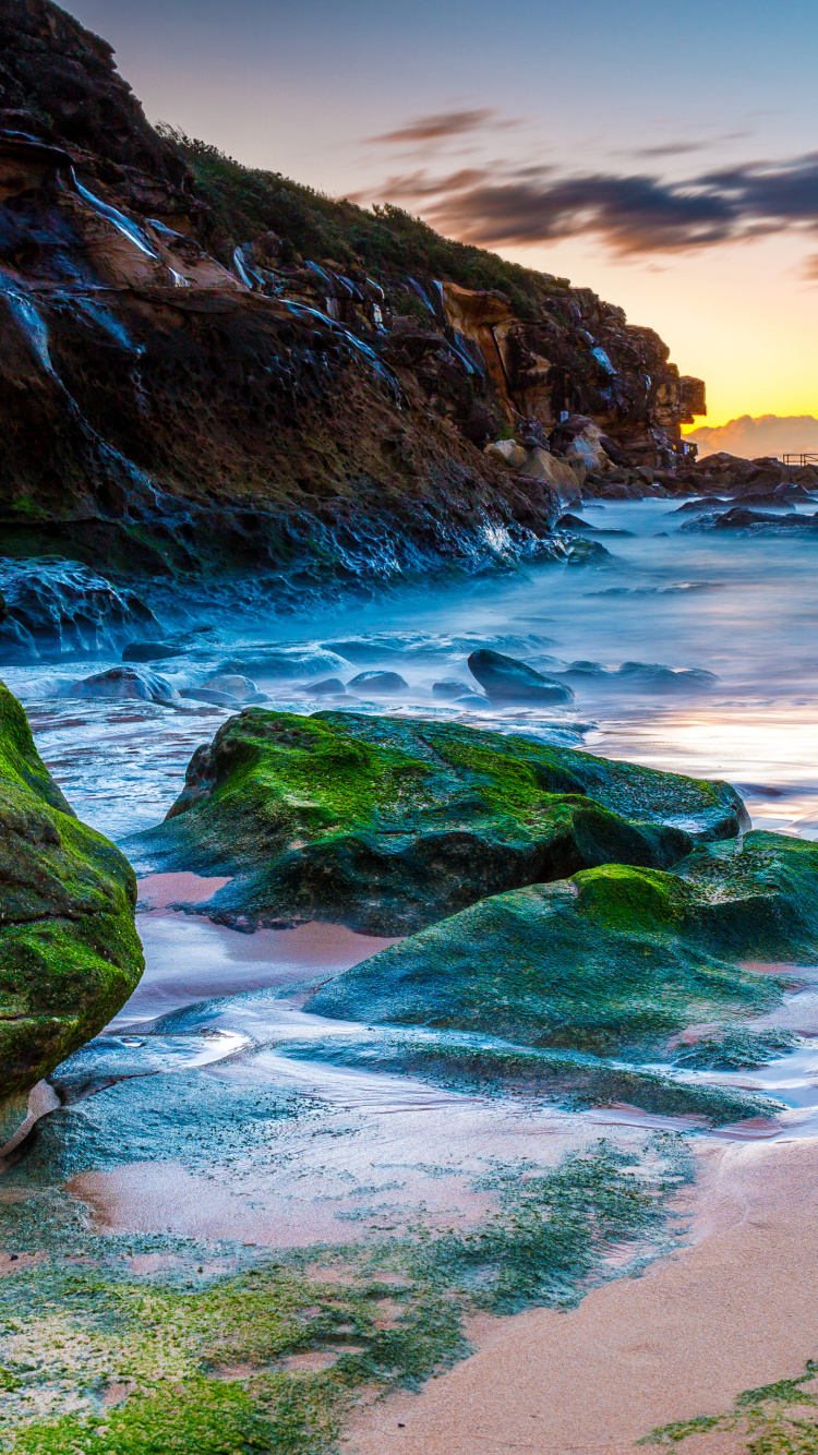 Green and Brown Rock Formation on Sea Shore During Sunset. Wallpaper in 750x1334 Resolution