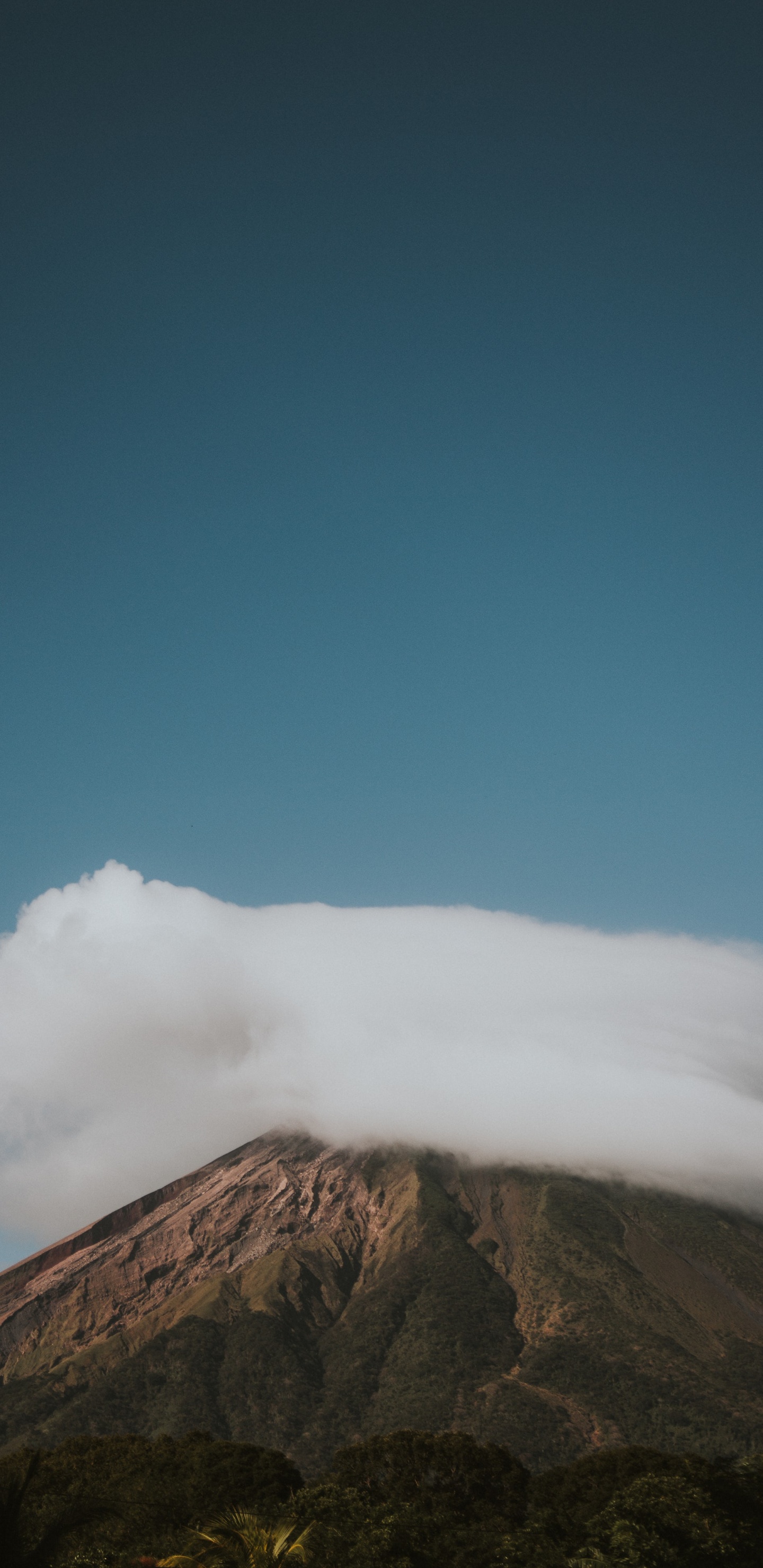 Brown Mountain Under Blue Sky During Daytime. Wallpaper in 1440x2960 Resolution