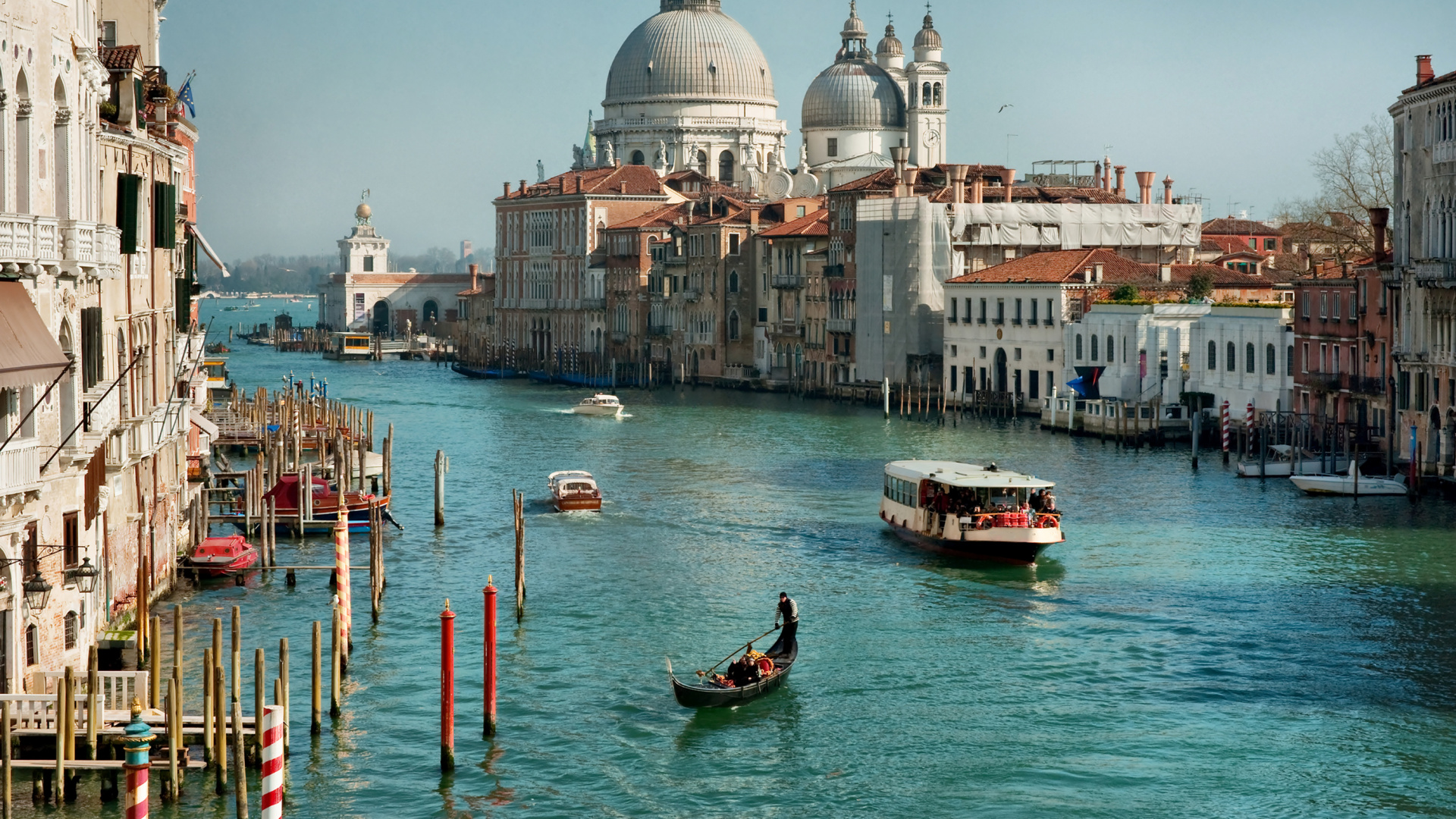 People Riding on Boat on River Near City Buildings During Daytime. Wallpaper in 1920x1080 Resolution