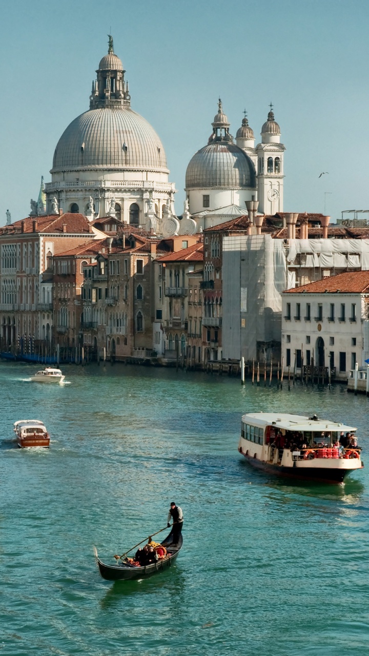 People Riding on Boat on River Near City Buildings During Daytime. Wallpaper in 720x1280 Resolution