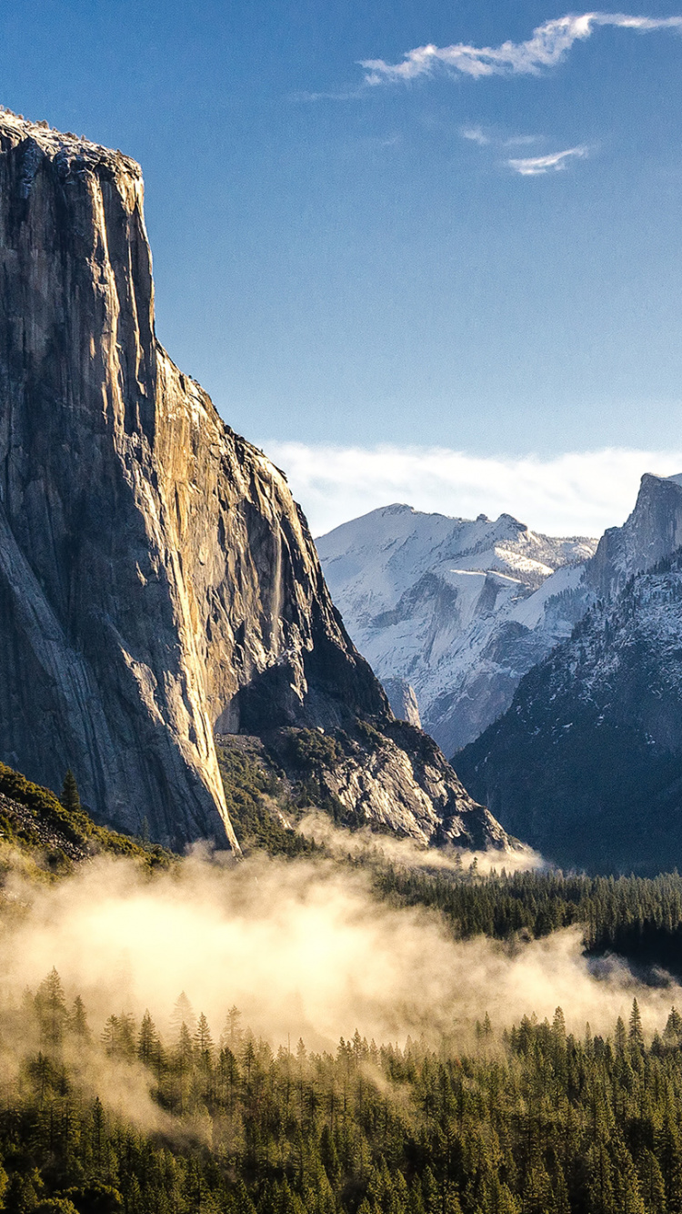 Green Grass Field Near Mountains Under Blue Sky During Daytime. Wallpaper in 750x1334 Resolution
