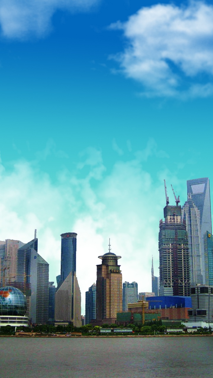 Horizon de la Ville Sous le Ciel Bleu Pendant la Journée. Wallpaper in 720x1280 Resolution