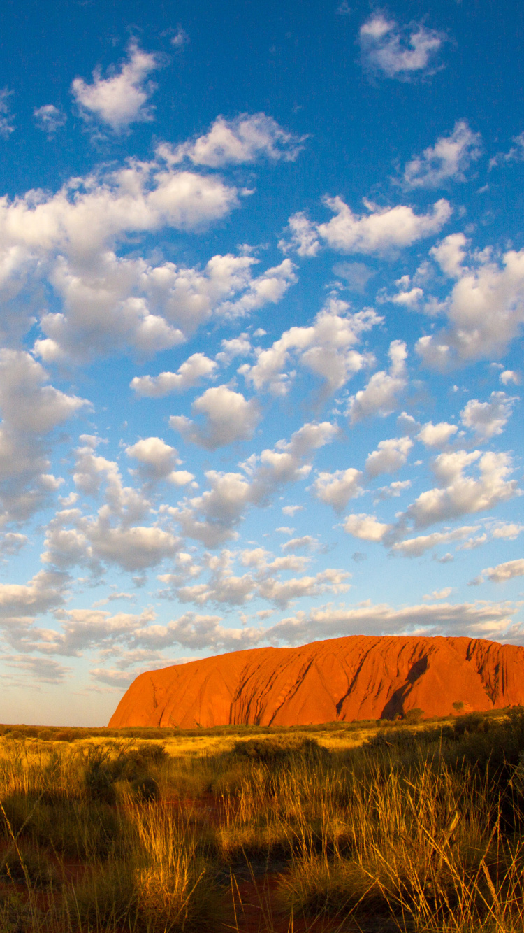 Brown Mountain Under Blue Sky and White Clouds During Daytime. Wallpaper in 750x1334 Resolution