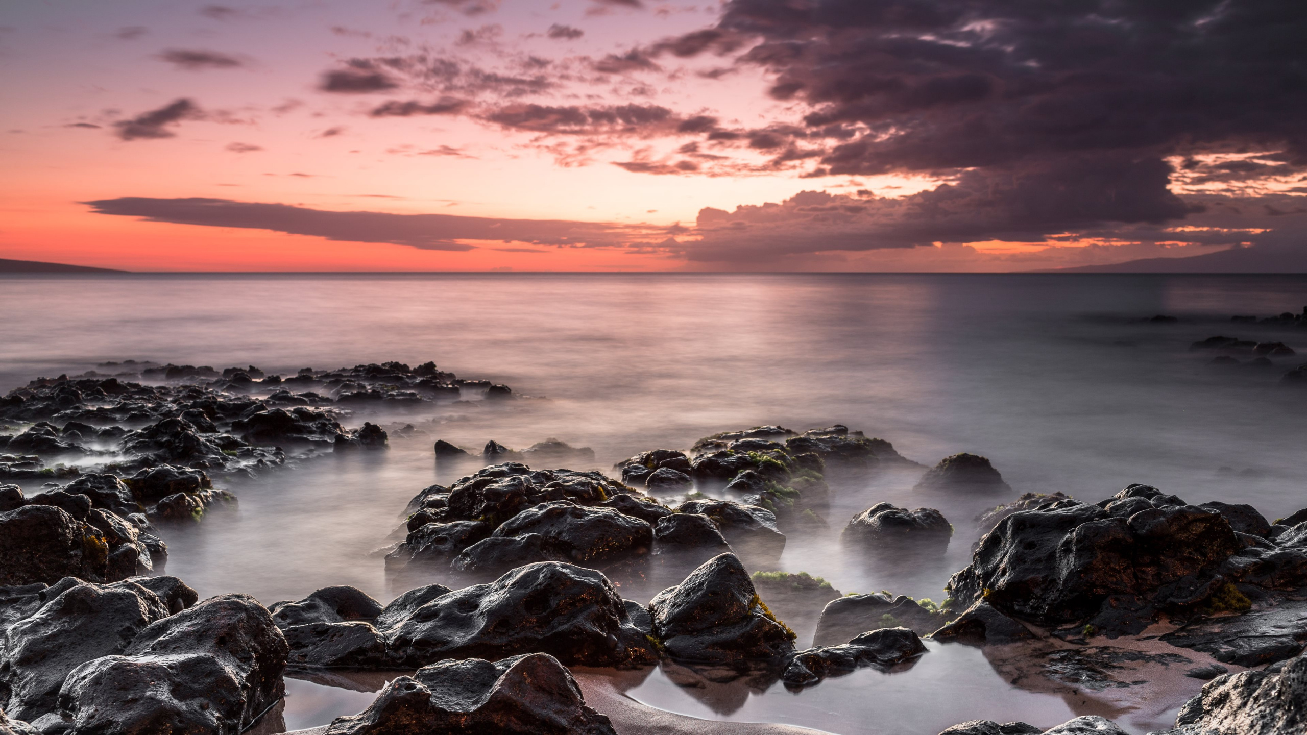 Rocky Shore Under Cloudy Sky During Daytime. Wallpaper in 2560x1440 Resolution
