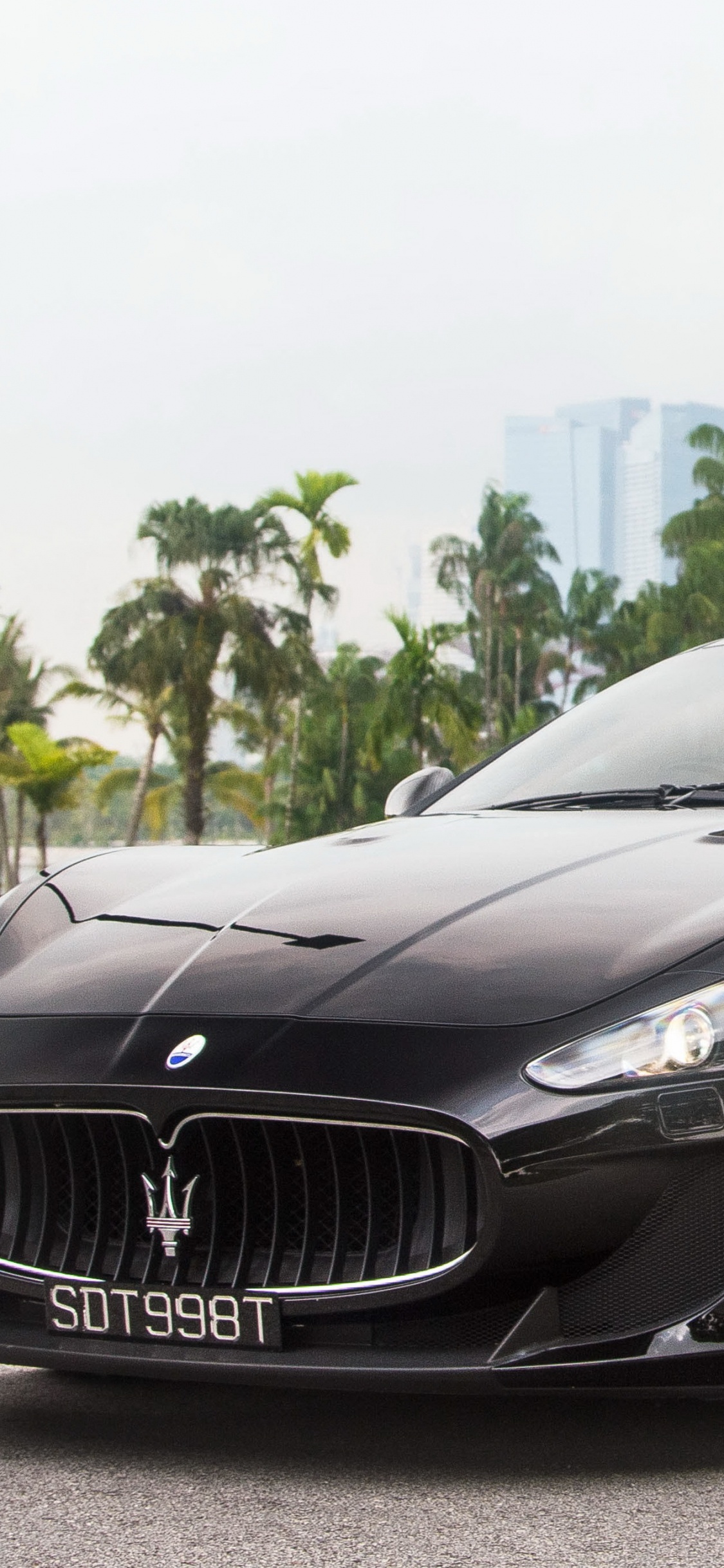 Black Mercedes Benz Coupe on Gray Asphalt Road During Daytime. Wallpaper in 1125x2436 Resolution