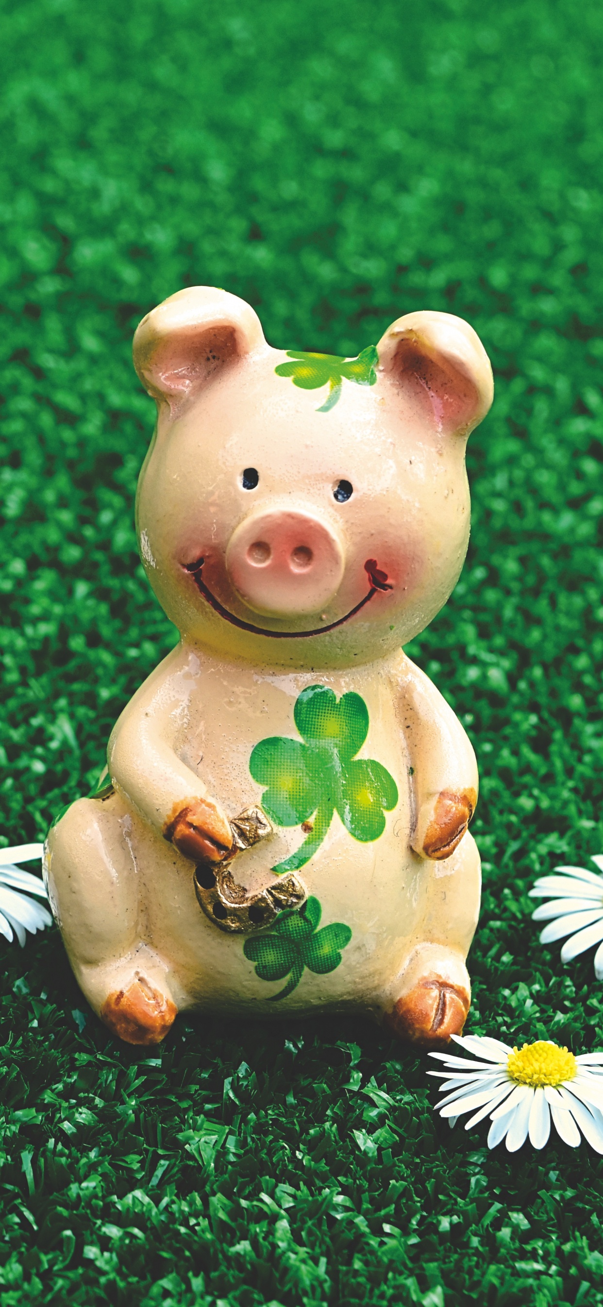 Pink Pig Ceramic Figurine on Green Grass Field. Wallpaper in 1242x2688 Resolution