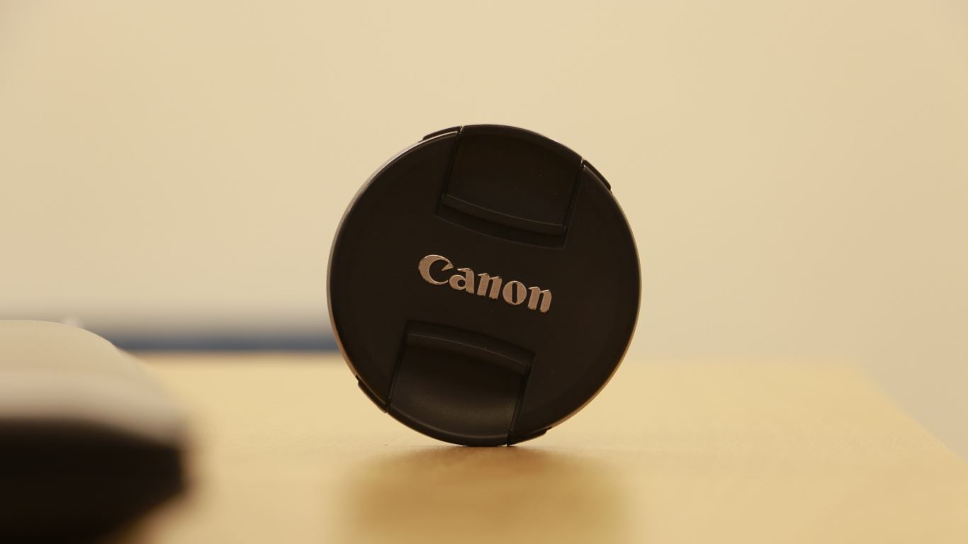 Black Nikon Camera Lens Cover. Wallpaper in 1366x768 Resolution