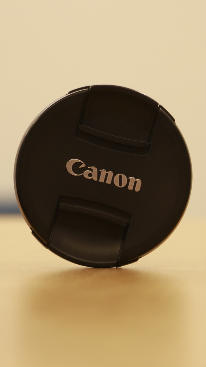 Black Nikon Camera Lens Cover. Wallpaper in 720x1280 Resolution