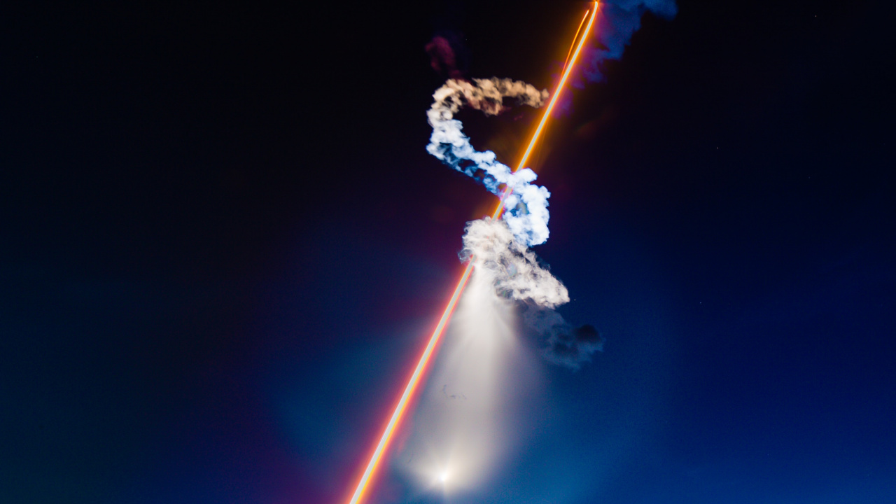 Man in White Shirt and Blue Denim Jeans Holding Fire Hose. Wallpaper in 1280x720 Resolution