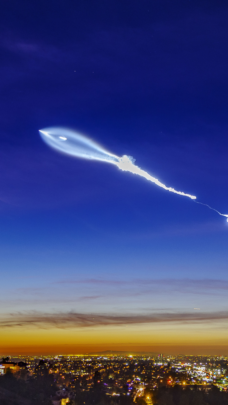 City With High Rise Buildings Under Blue Sky During Night Time. Wallpaper in 750x1334 Resolution