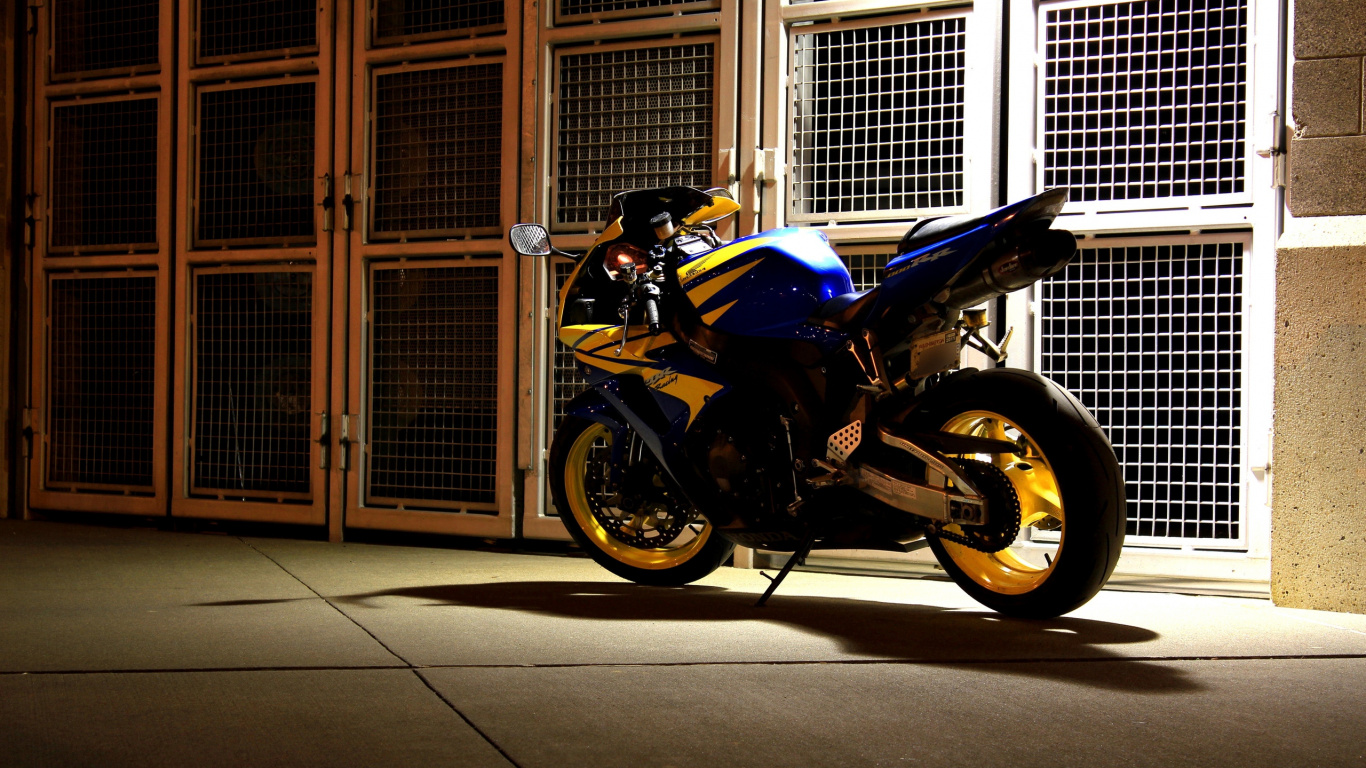 Blue and Black Sports Bike Parked Beside Brown Wooden Door. Wallpaper in 1366x768 Resolution