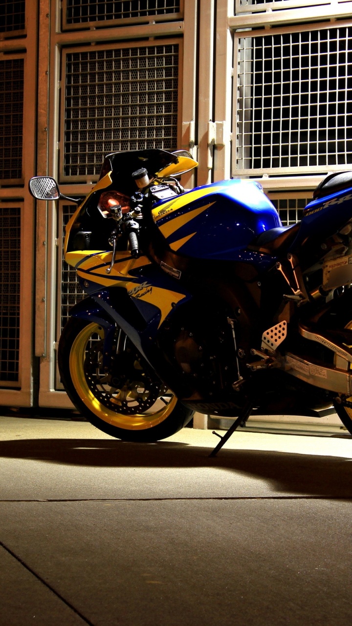 Blue and Black Sports Bike Parked Beside Brown Wooden Door. Wallpaper in 720x1280 Resolution