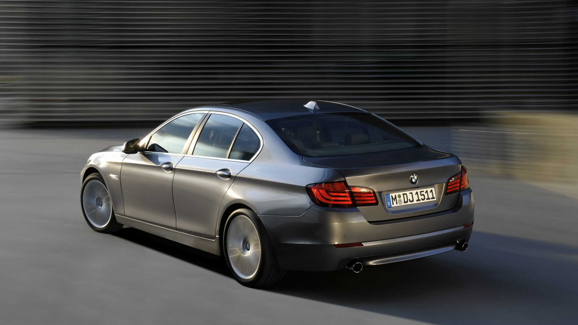 Silver Mercedes Benz Sedan Parked Near Gray Roll up Door. Wallpaper in 1920x1080 Resolution