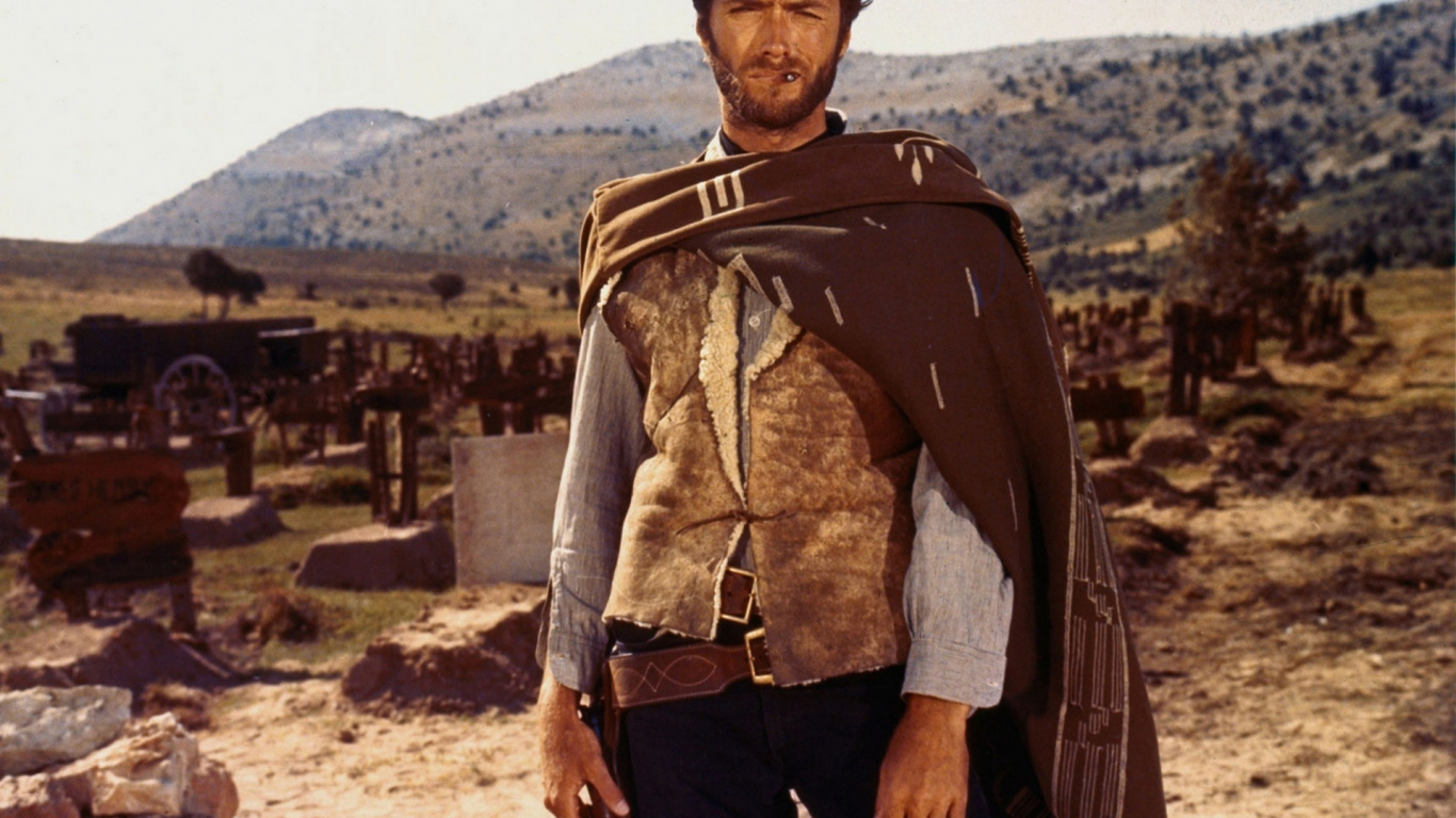 Hombre Con Chaqueta de Cuero Marrón y Pantalón Negro Con Chaqueta de Cuero Marrón de Pie en Campo Marrón. Wallpaper in 1366x768 Resolution