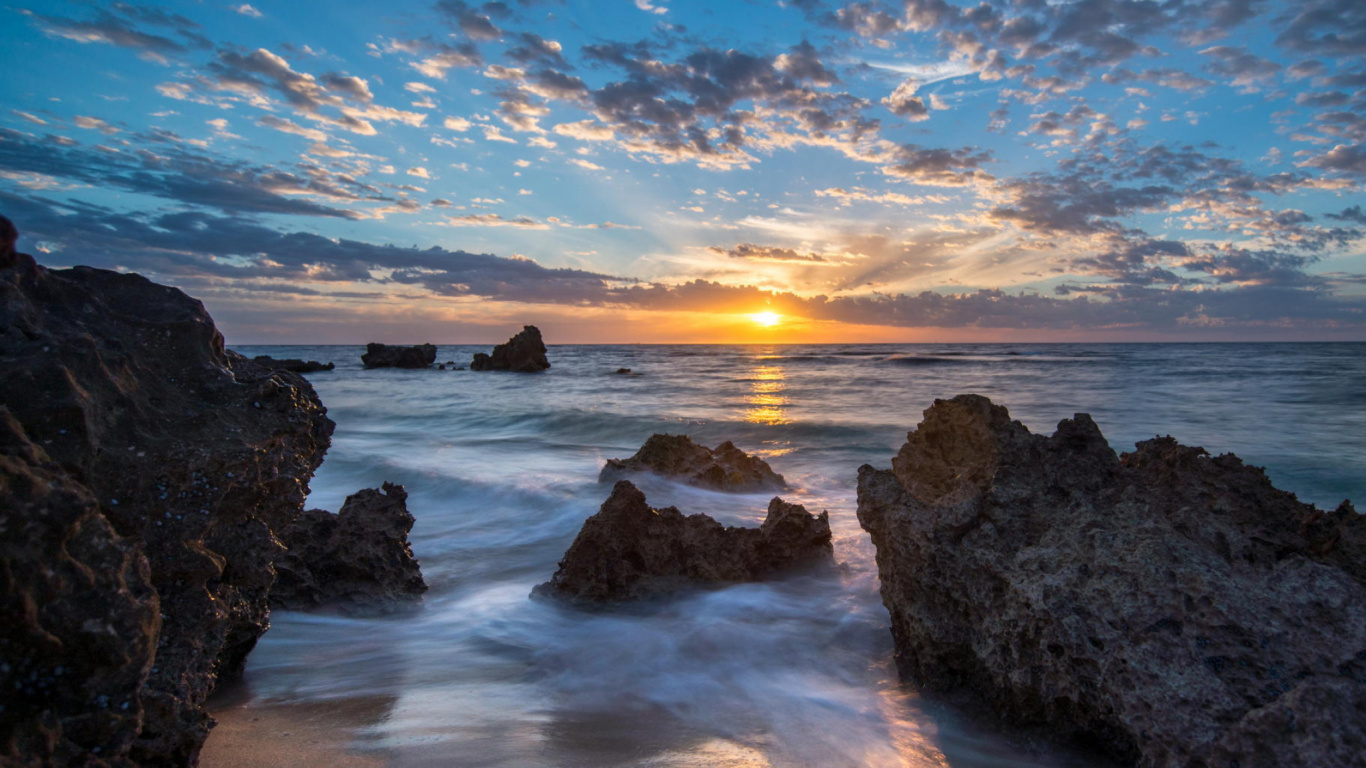 Rocky Shore Under Blue Sky During Sunset. Wallpaper in 1366x768 Resolution