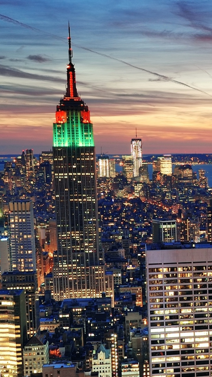 City Skyline Under Orange and Blue Sky During Sunset. Wallpaper in 720x1280 Resolution