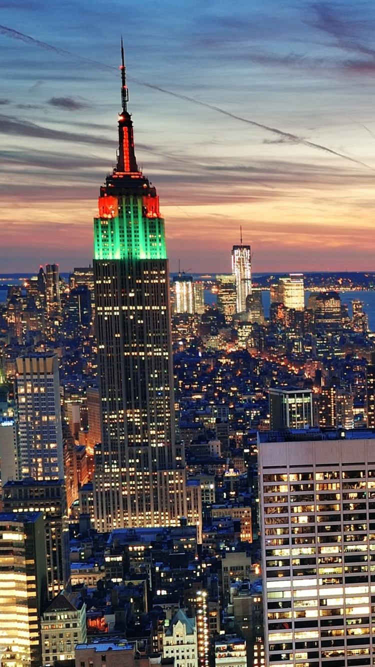 City Skyline Under Orange and Blue Sky During Sunset. Wallpaper in 750x1334 Resolution