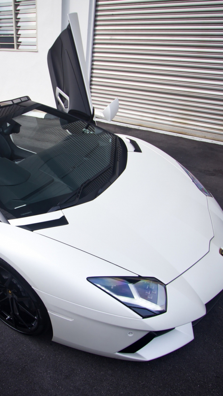 White Porsche 911 Parked Near White Building. Wallpaper in 750x1334 Resolution