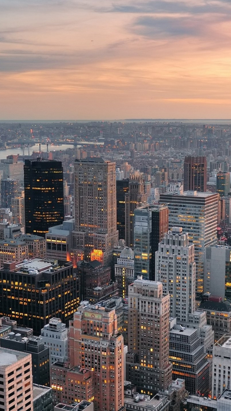 Aerial View of City Buildings During Sunset. Wallpaper in 750x1334 Resolution