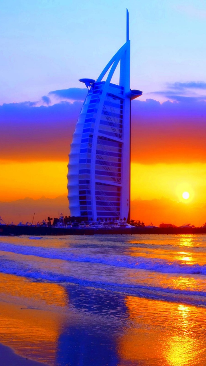 White and Black Building Near Body of Water During Sunset. Wallpaper in 720x1280 Resolution