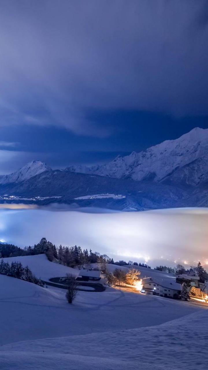 Snow Covered Mountain During Night Time. Wallpaper in 720x1280 Resolution