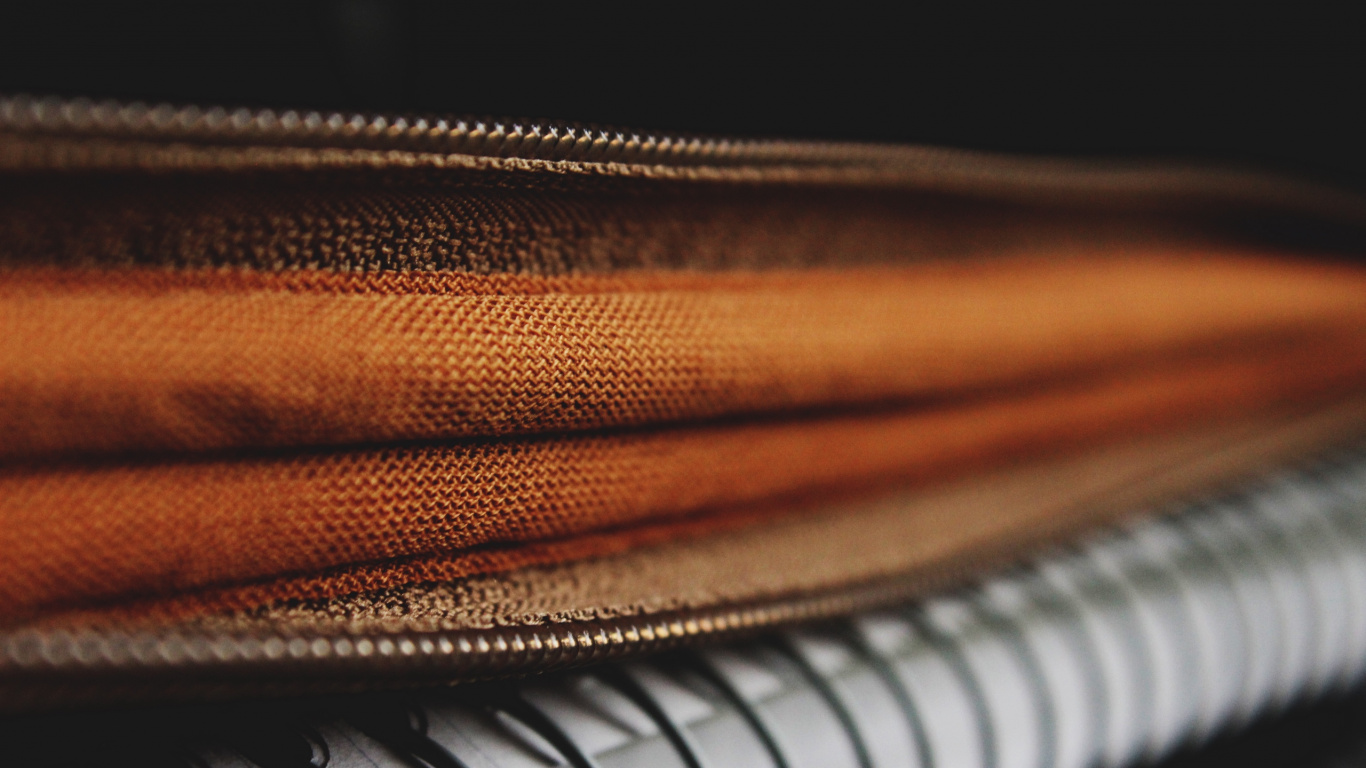 Brown Leather Zip Bag on White and Black Piano. Wallpaper in 1366x768 Resolution