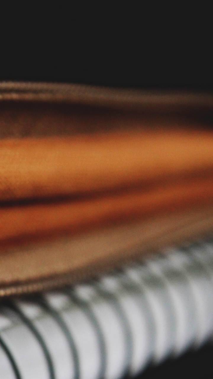 Brown Leather Zip Bag on White and Black Piano. Wallpaper in 720x1280 Resolution