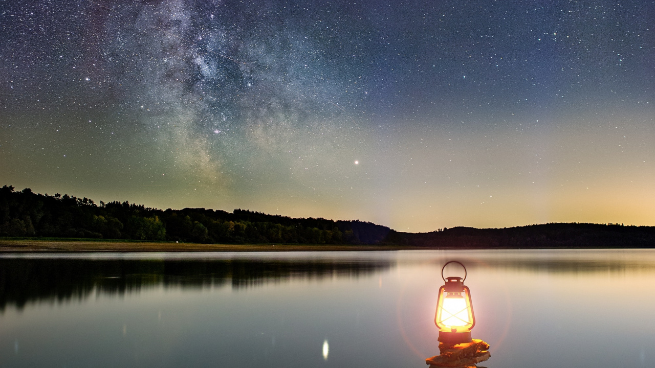Body of Water Near Mountain During Night Time. Wallpaper in 1280x720 Resolution