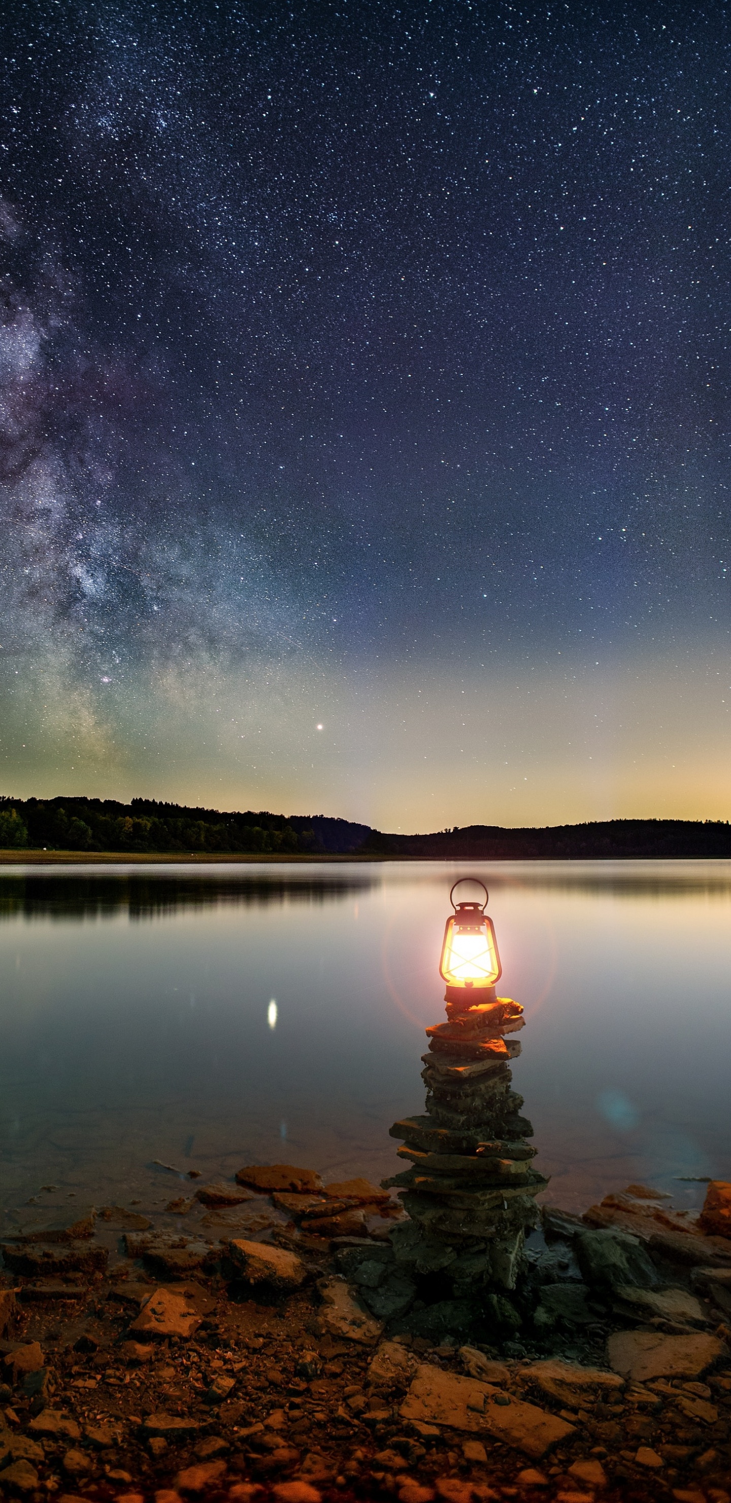 Body of Water Near Mountain During Night Time. Wallpaper in 1440x2960 Resolution