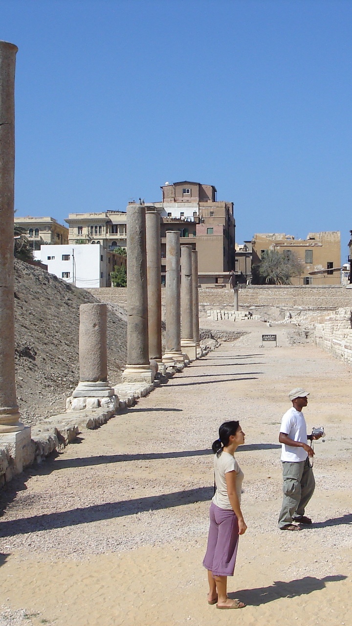 Woman in White Shirt Walking on Pathway During Daytime. Wallpaper in 720x1280 Resolution