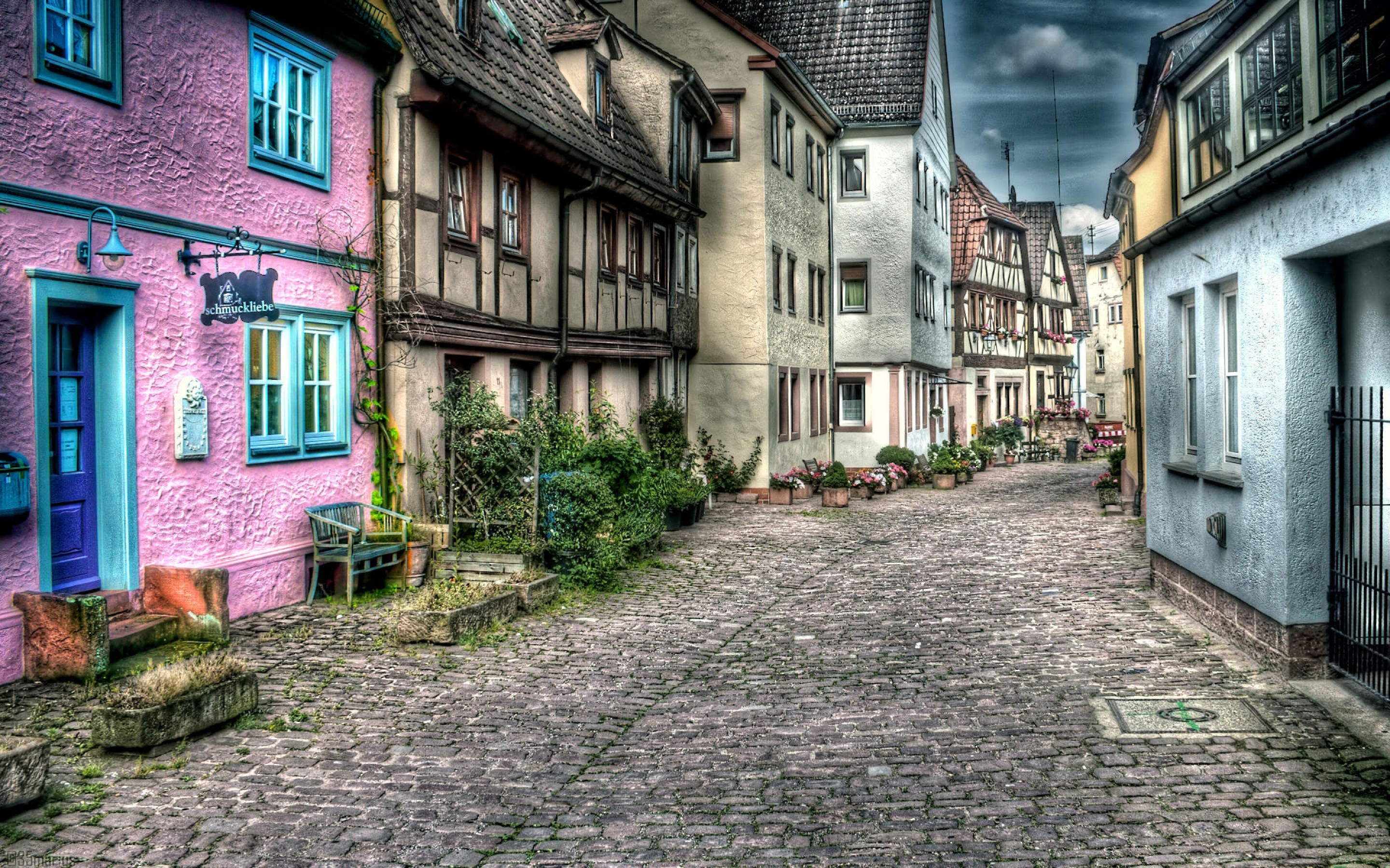 Wallpaper Brown Brick Pathway Between Houses During Daytime Background Download Free Image